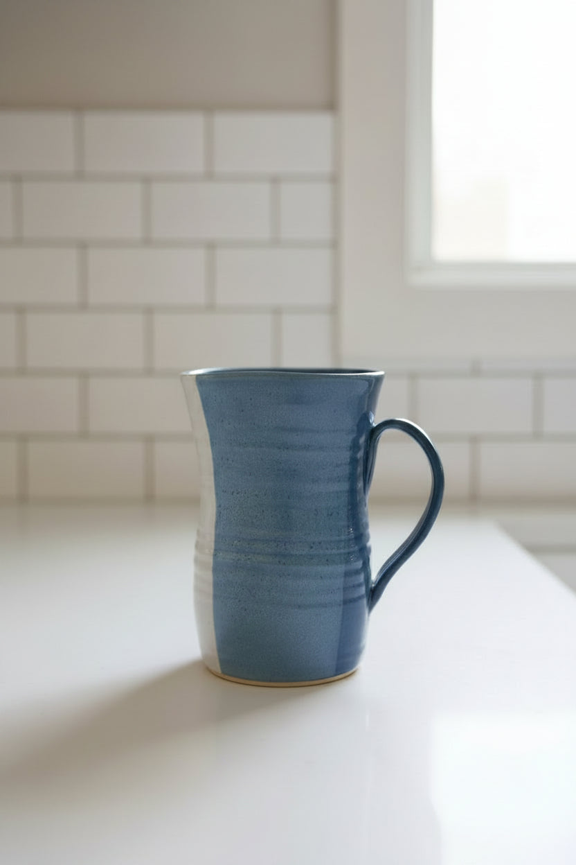 Blue ceramic pitcher on counter