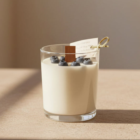Handmade candle with wax blueberries in a galss jar