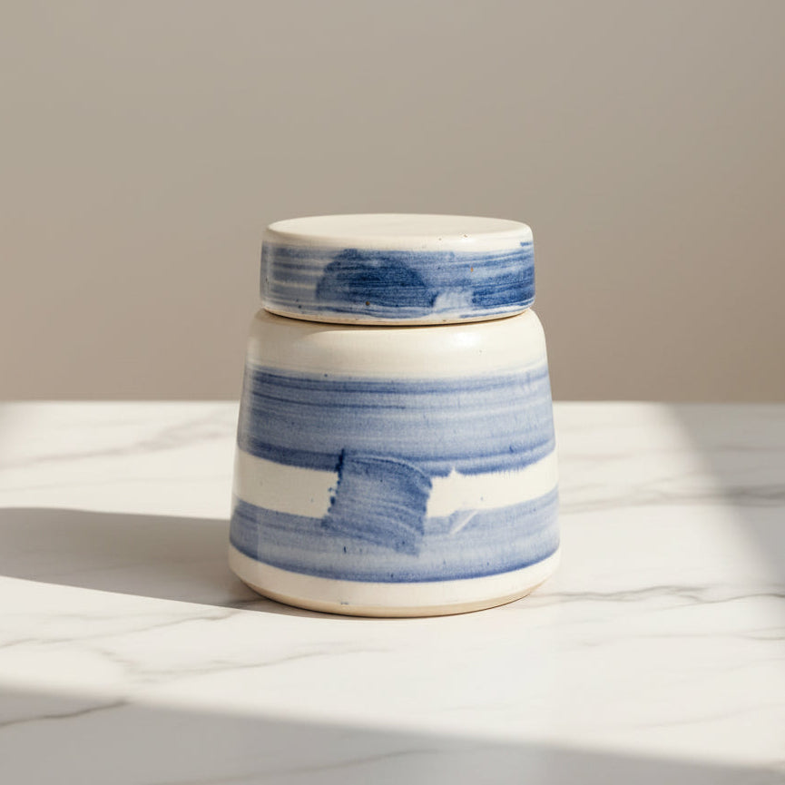 Ceramic jar with blue and white stripes