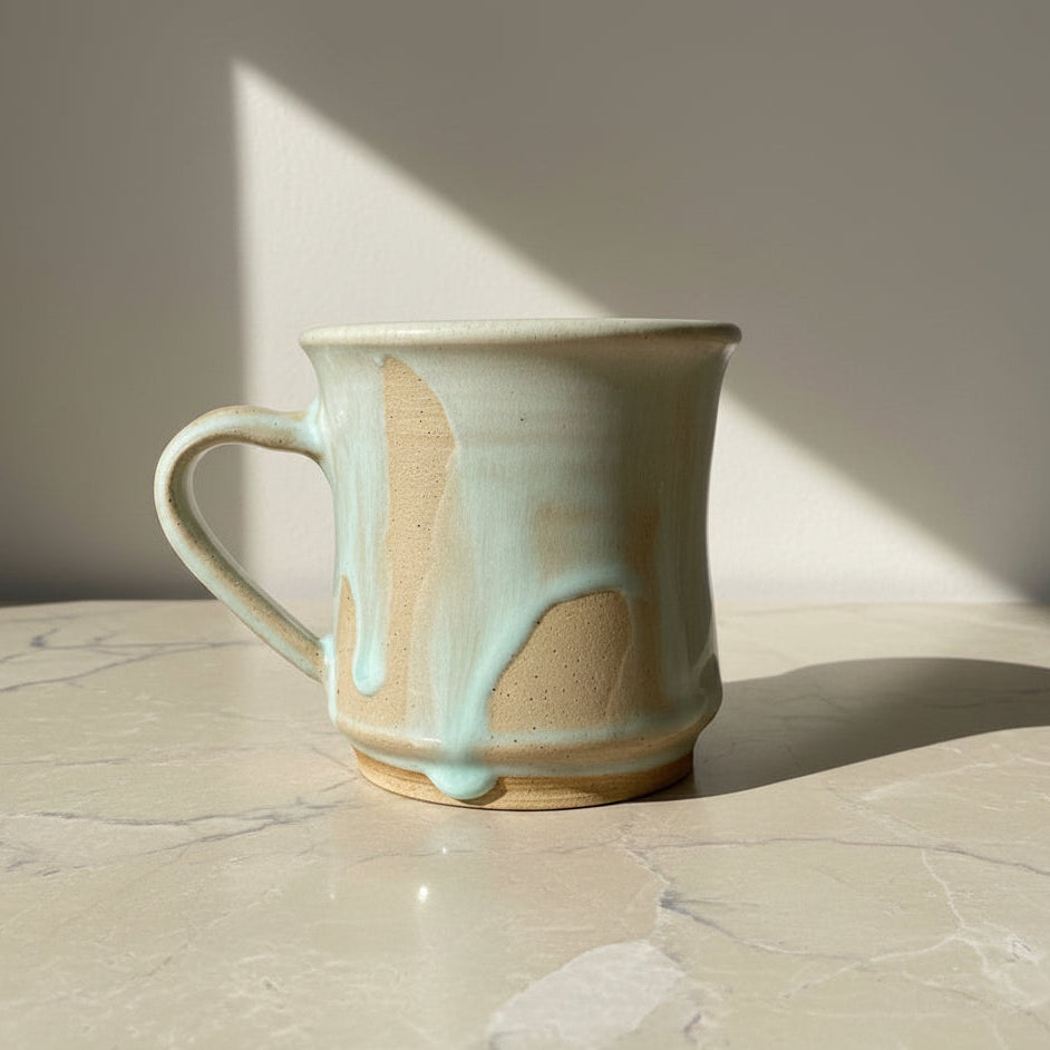 Handmade ceramic mug with a textured surface