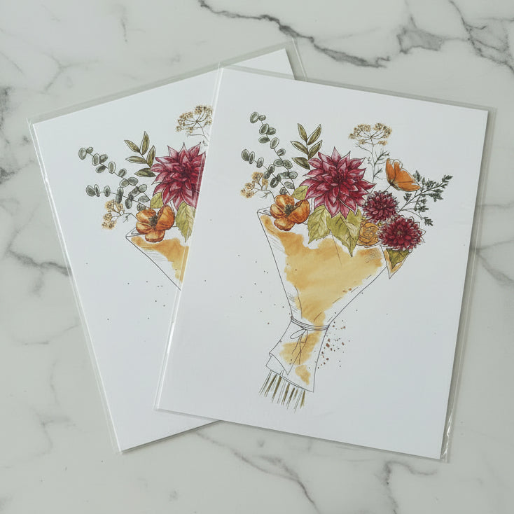 Two watercolor art prints depicting bouquets of autumn flowers