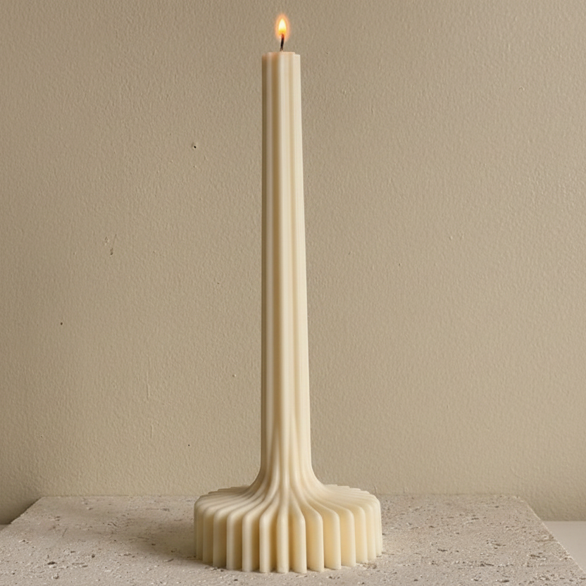 A single white pillar candle