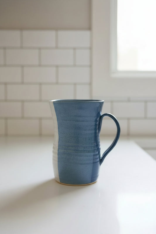 Blue ceramic pitcher on counter 