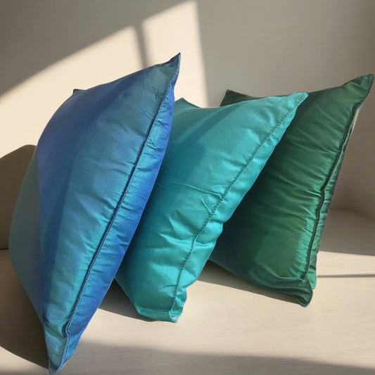 Silk pillows in jewel tones, including teal, turqouise and emerald green