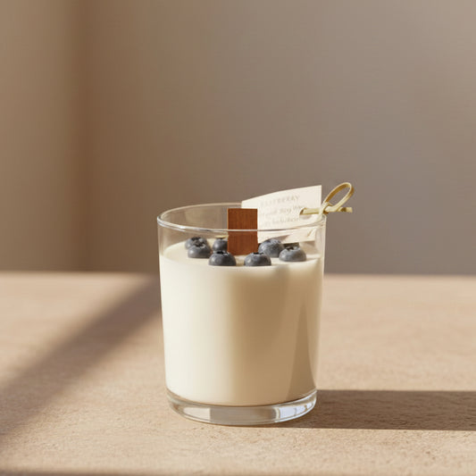 Handmade candle with wax blueberries in a galss jar