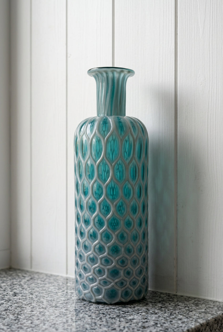 honeycomb textured glass vase in a glossy teal blue-green color.