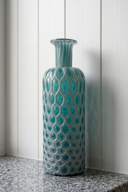 honeycomb textured glass vase in a glossy teal blue-green color.