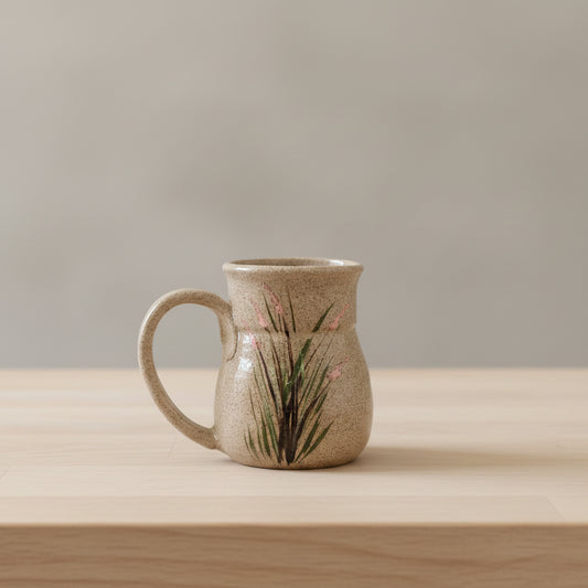 Ceramic mug with floral design on shelf