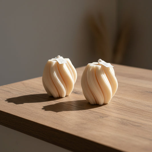 Swirl shapped candles on a wood counter