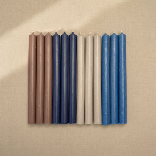Dripless taper candles lined up in a row