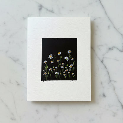Artwwork featuring a black background with a cluster of white daisies with yellow centers and green stems.