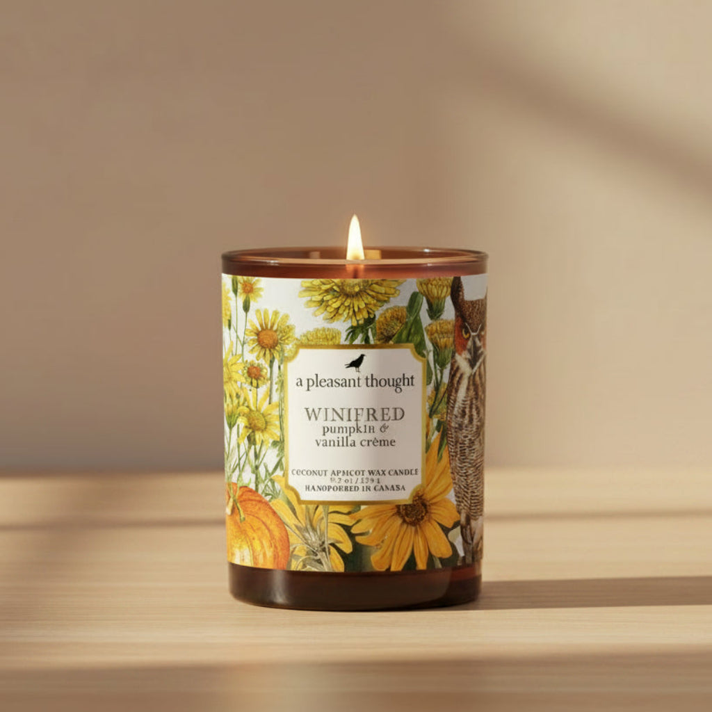 Amber glass vessel candle with Winifred candle label