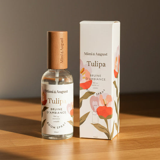 A room spray bottle with a light wood cap.